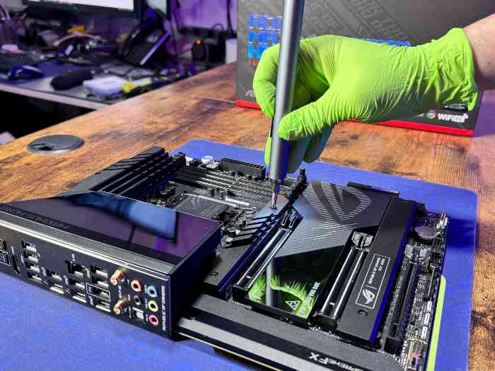 A Prime Tech Support technician is repairing the logic board of a Gaming PC.