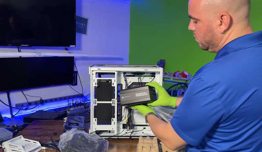 "Prime Tech Support technician with a PSU in Miami, FL, assembling a PC for gaming enthusiasts.