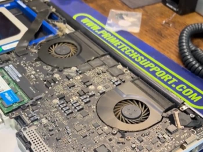 MacBook Pro very dirty and full of dust, ready to be cleaned by a Prime Tech Support technician.