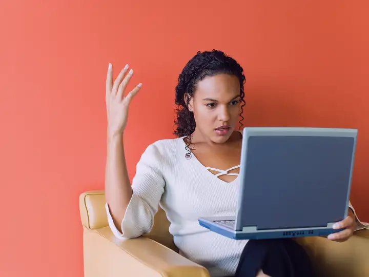 Woman frustrated because of her broken laptop. Our Prime Technician will go to her location to diagnose and fix her computer in no time.