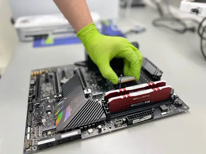 Prime Tech Support in Miami, Florida Technician installing a new CPU into a gaming PC motherboard, as part of the maintenance for a Gaming PC