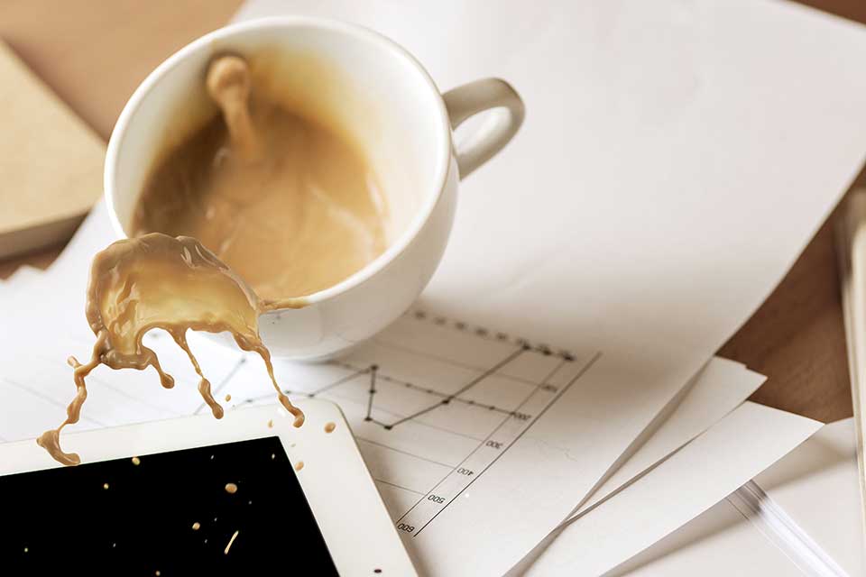 Coffe Spill suffer by a person working in his office. The spill happens on top on his iPad. Prime Tech Support fixes liquid damage for all computers and tablets.