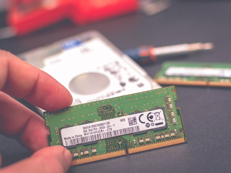 Prime Tech Support Technician holding Memory RAM to update a Laptop in Lab located in Miami