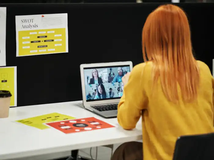 Woman using her MacBook Pro in Miami and implementing the step by step guide provided by Prime Tech Support blog post