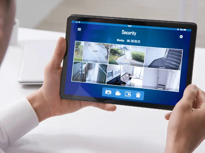 Man checking his home security cameras, Prime Tech Support install security cameras for homes in Miami