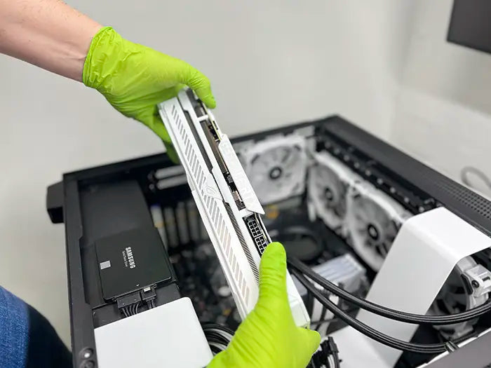 Gaming PC GPU Service performed in Prime Tech Support Lab located in Miami. The technician is holding the GPU to install it in the new Gaming PC