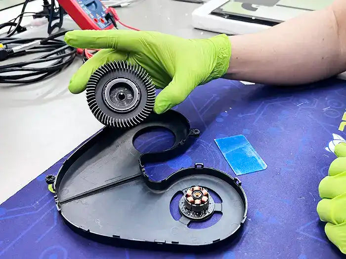 At the Prime Tech Support Lab in Miami, our technician provides an iMac computer cleaning service. They utilize an air cleaning device to ensure the unit remains free of dust, preventing potential overheating issues.