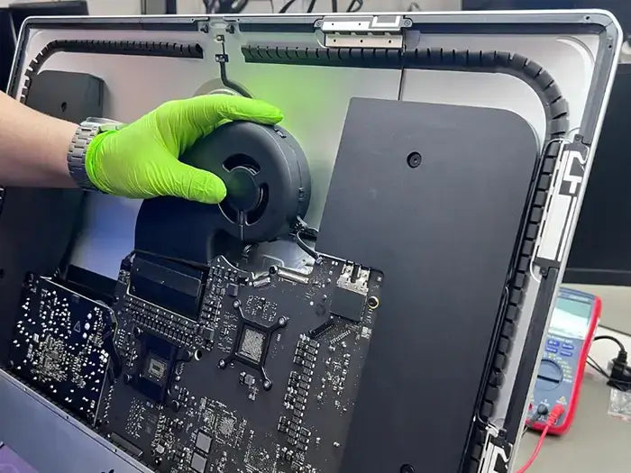 Prime Tech Support Technician performing an iMac Diagnostic where he examines in detail all the hardware and software aspect of the device to ensure an accurate repair afterwards.