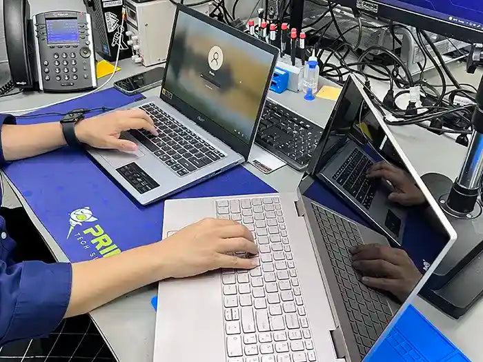 Prime Tech Support technician performing a laptop data transfer for a customer located in Miami Dade County.