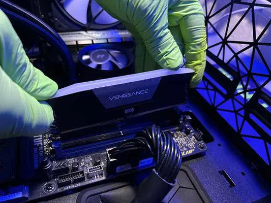 Technician at Prime Tech Support in Miami expertly installs a RAM stick into a computer