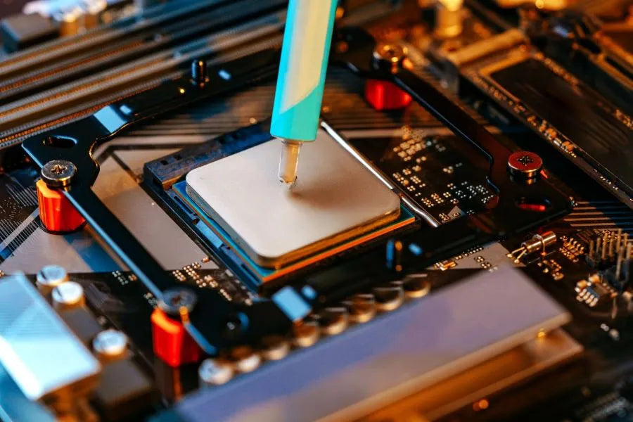 Applying thermal paste to a CPU during gaming PC maintenance