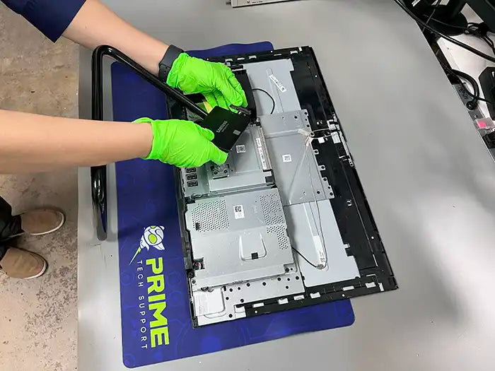 All in One computer hard drive replacement performed at Prime Tech Support Lab in Miami. Our tech is upgrading the computer to a Solid State