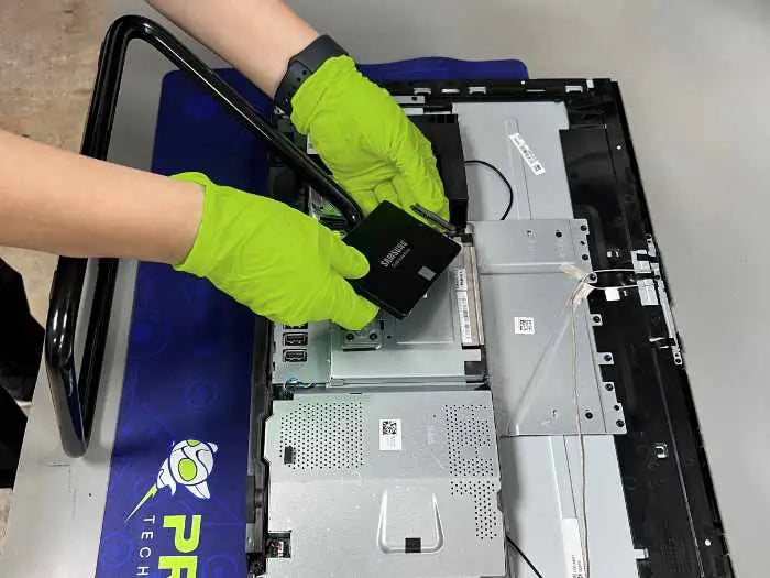 All in One computer hard drive replacement performed at Prime Tech Support Lab in Miami. Our tech is upgrading the computer to a Solid State