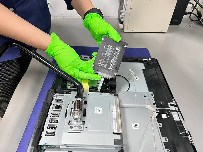  At the Prime Tech Support Lab in Miami, our technician carries out a hard drive replacement for an All-in-One computer. They are upgrading the computer to a Solid State Drive (SSD) for improved performance.