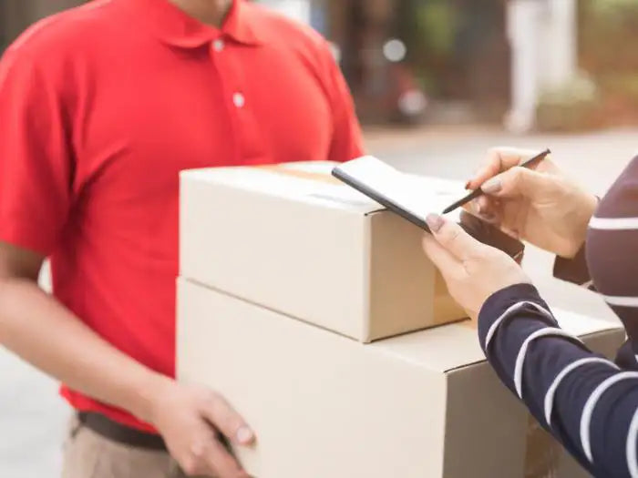 Delivery man picking up a computer from a customer located in Miami who is going to have her computer repaired by our technicians. The device will be delivered to her once repaired.