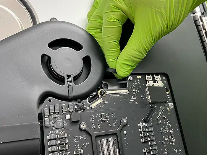 Technician performing an iMac logic board repair at the specialized lab in Prime Tech Support located in Miami
