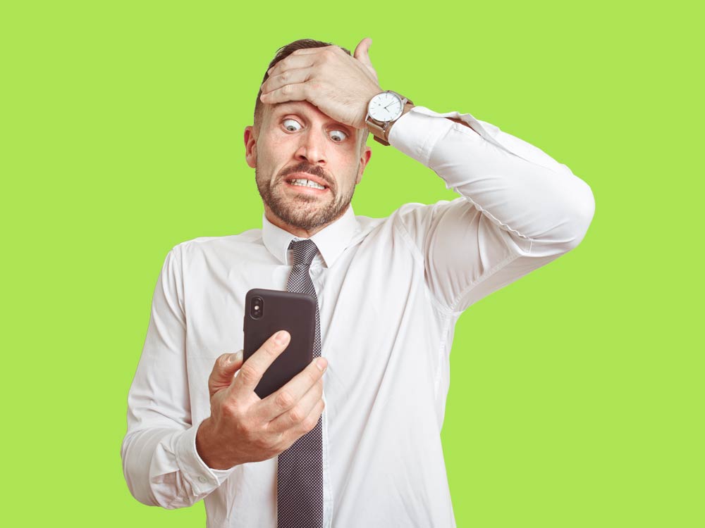 Customer holding a smartphone after losing important data, representing the need for iPhone data recovery services.