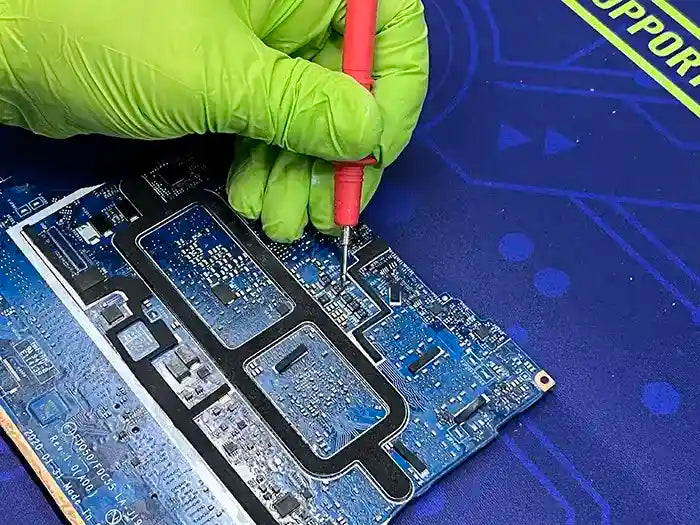 Prime Tech Support technician micro soldering to repair a laptop motherboard for a client located in Miami 