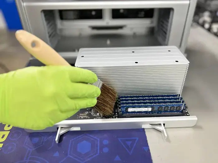 Mac Pro computer cleaning performed at Prime Tech Support Lab in Miami. Our tech is using a air cleaning device to keep the unit free of dust to avoid overheating.